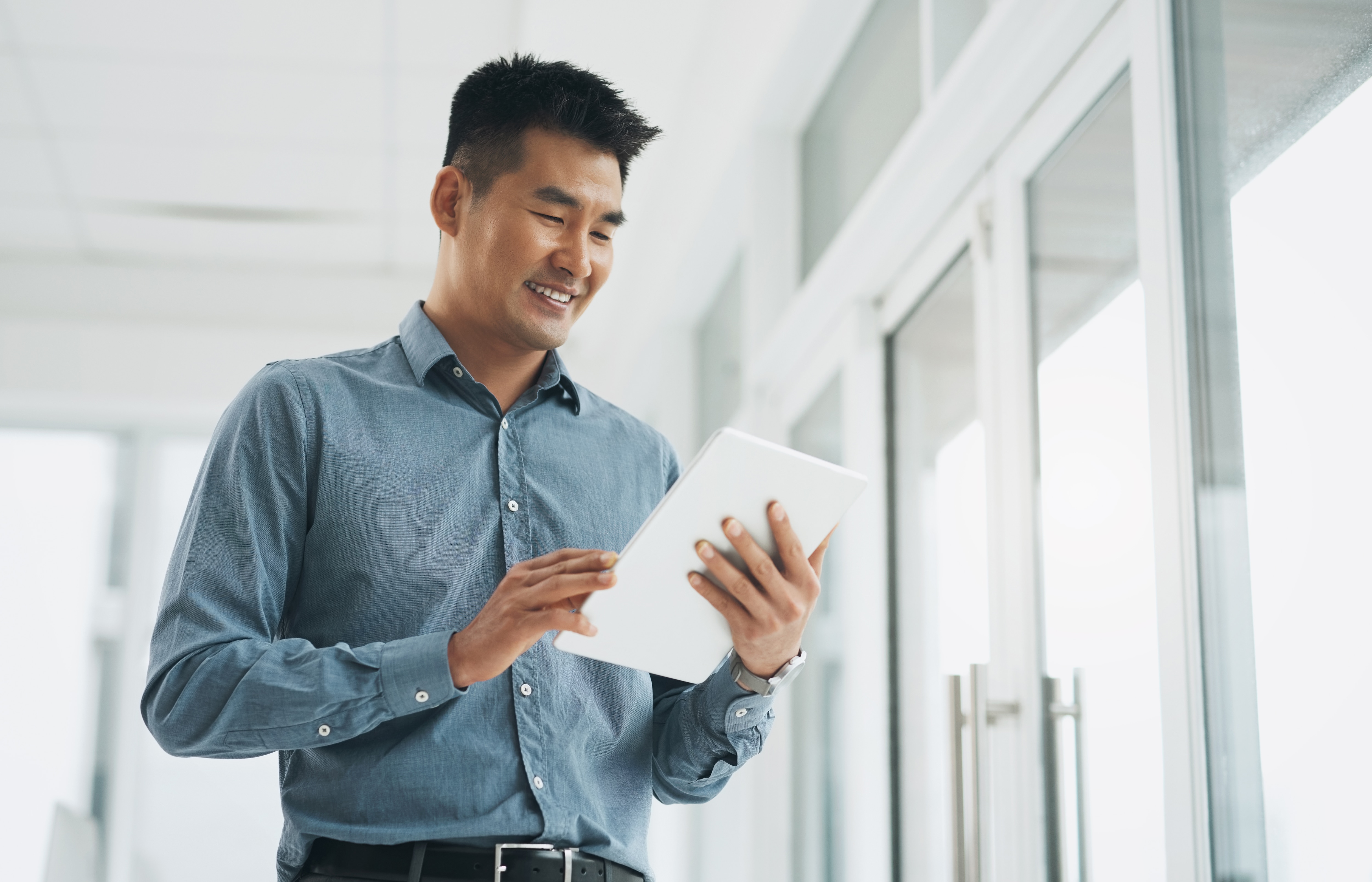 man looking at tablet