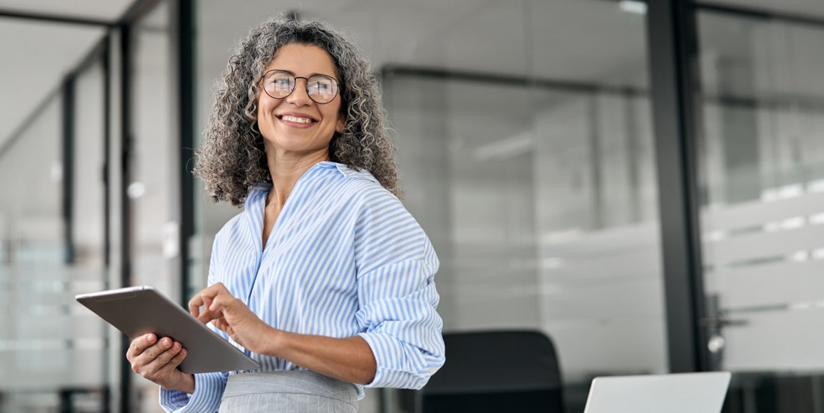 woman smiling, in the office