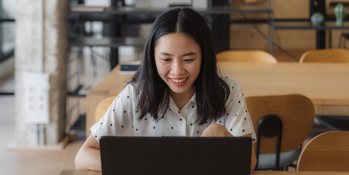 woman working on a laptop at a table