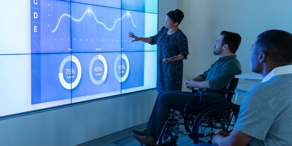 3 professionals meeting, data presentation in the office