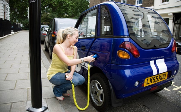 woman filling up car