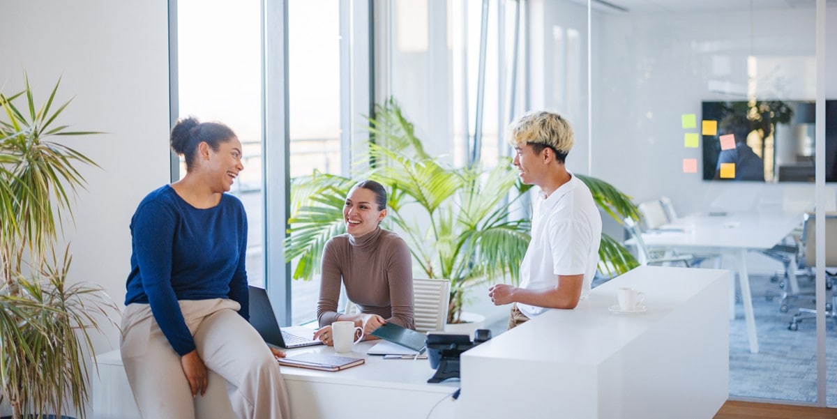 group of 3 professionals meeting in the office
