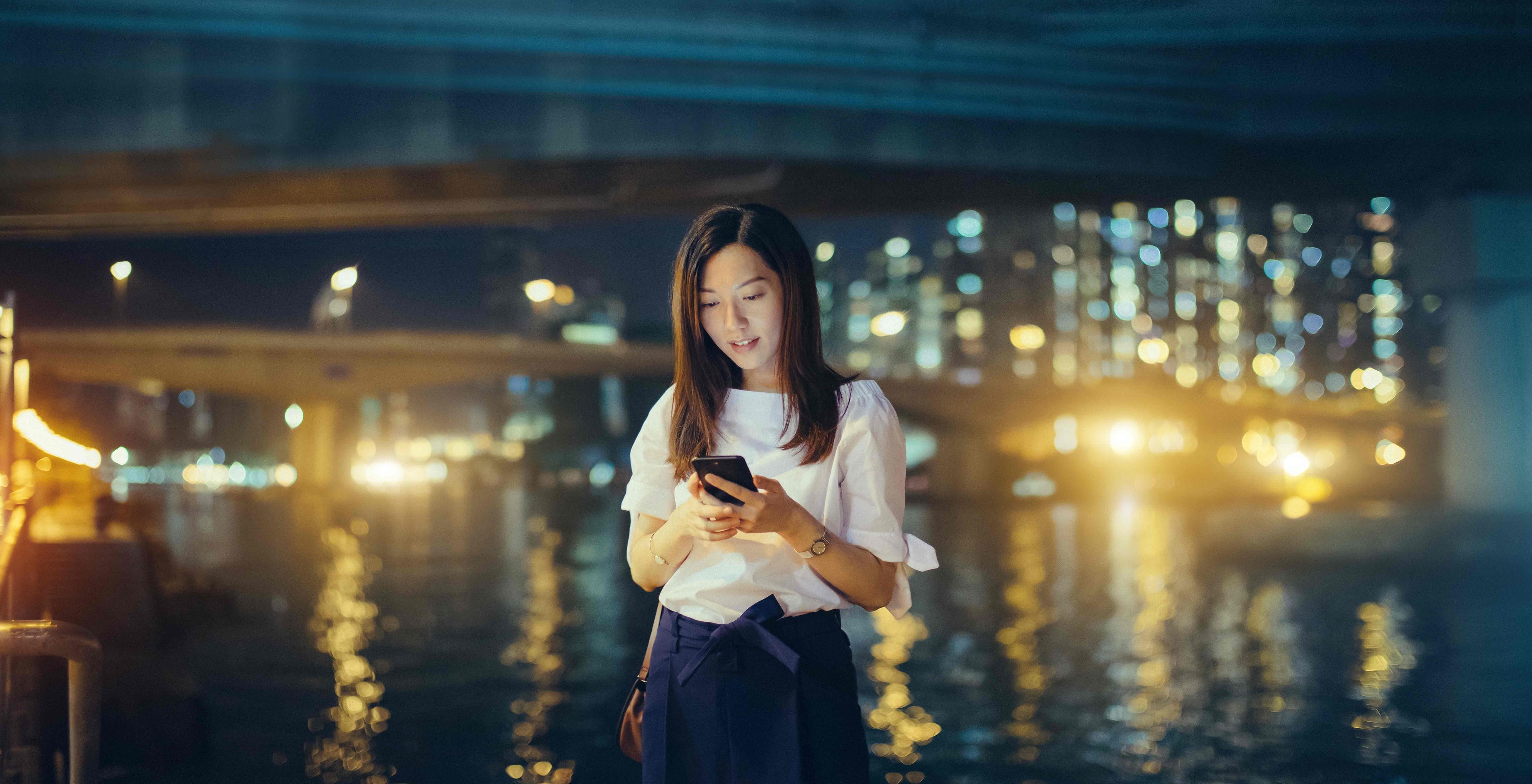 woman looking at phone