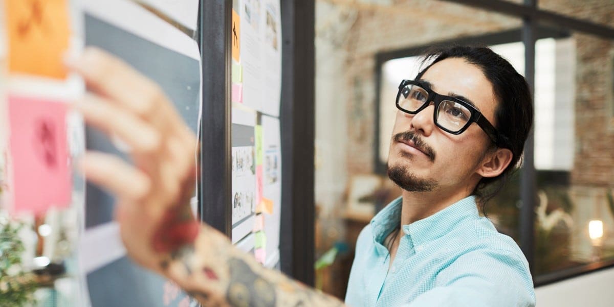 professional man in office at whiteboard