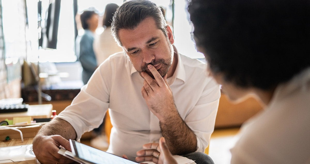 Man and woman looking at tablet