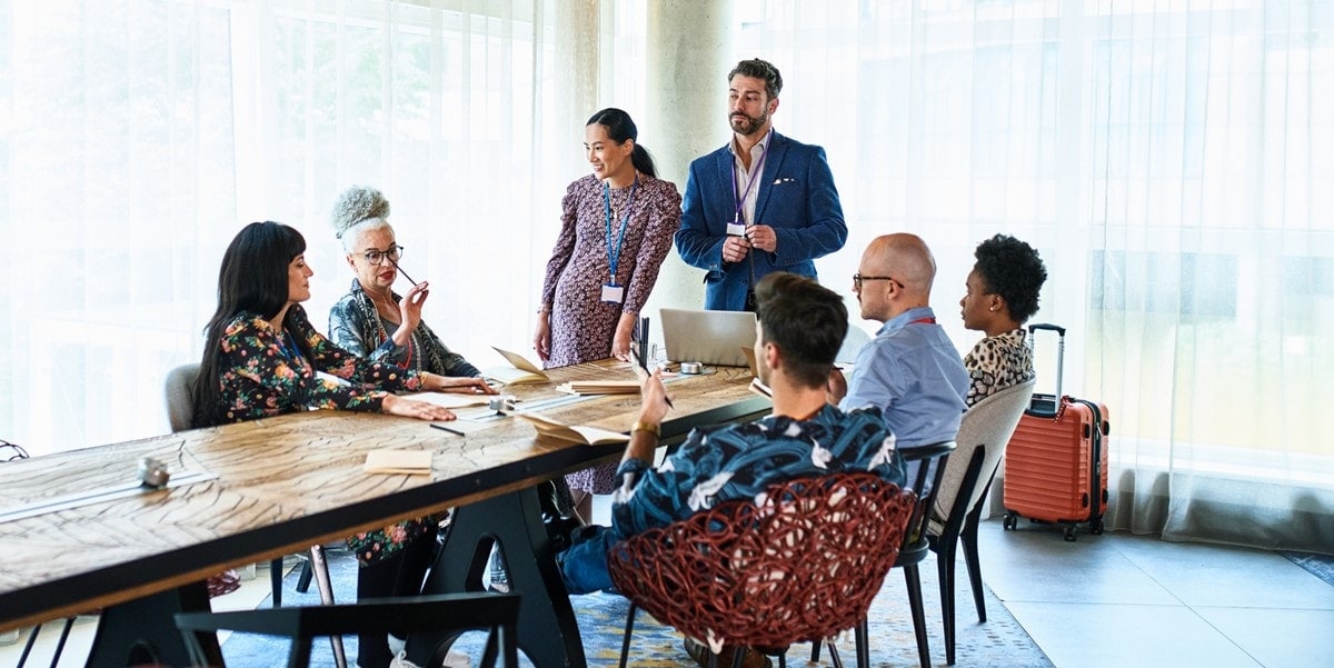 group of people meeting at a conference table