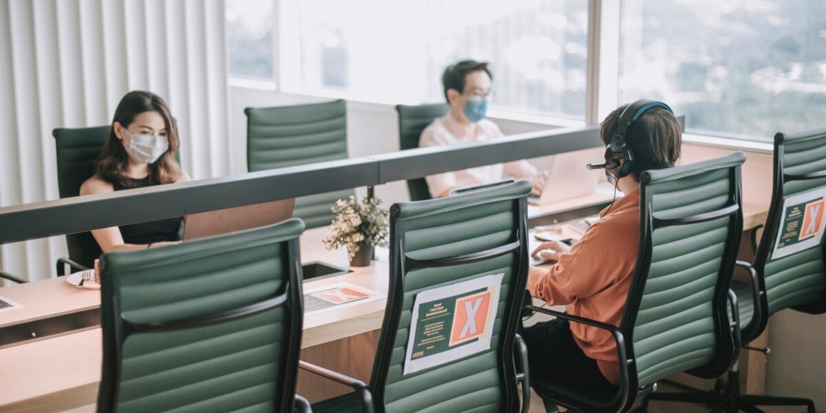 workers working at a desk together