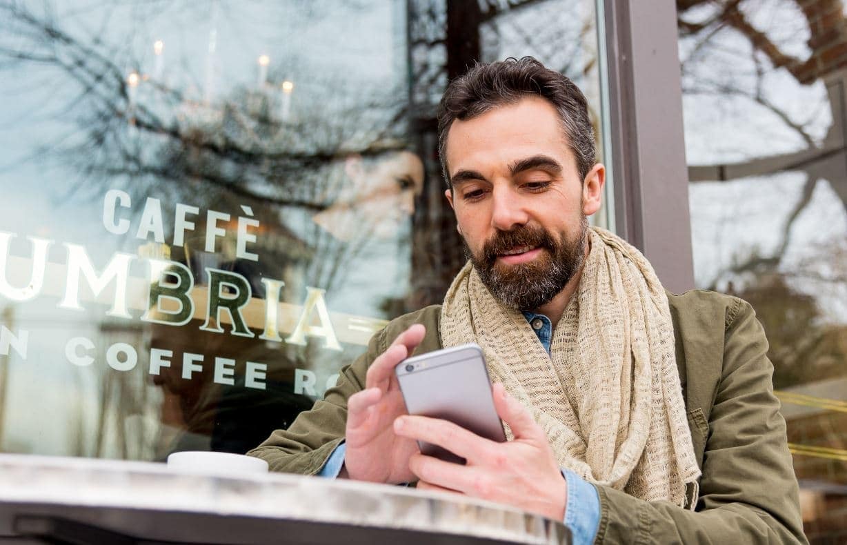 man looking at mobile phone