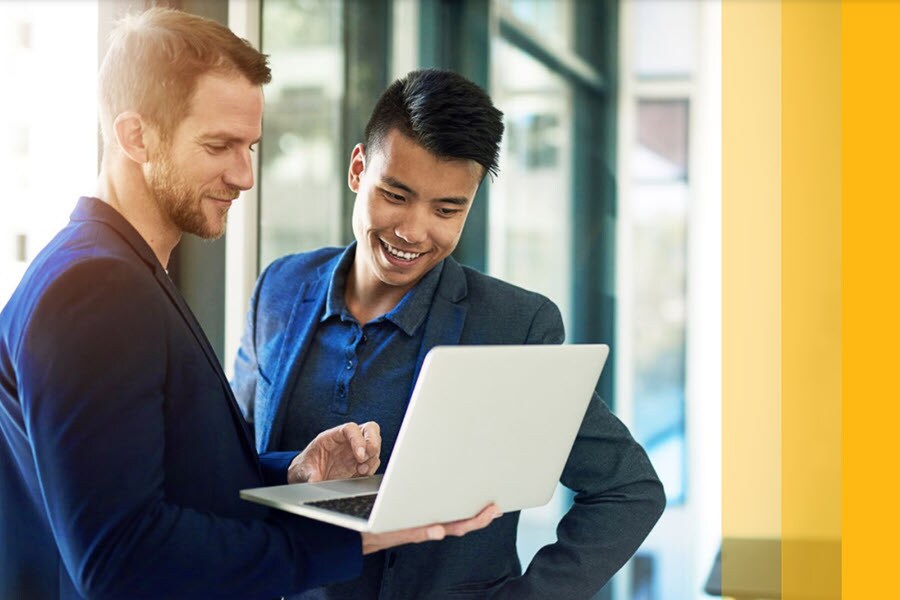 men looking at laptop