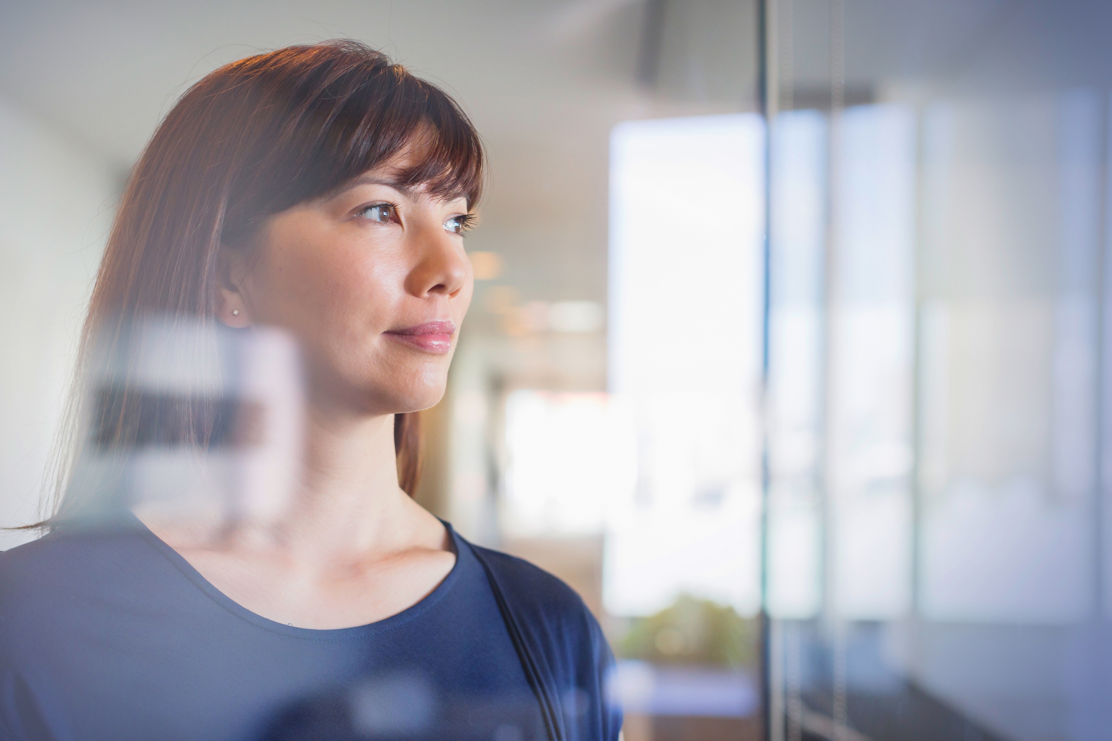 woman looking out of the window