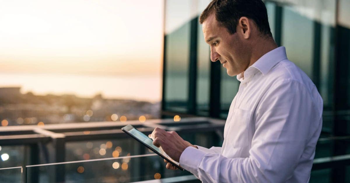 man looking at tablet
