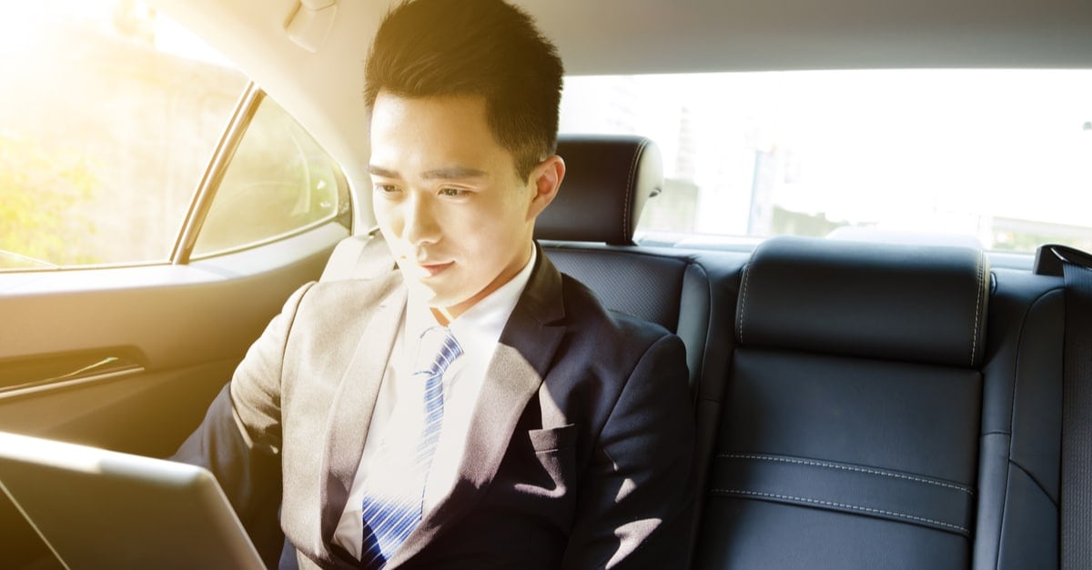 business man looking at a laptop screen