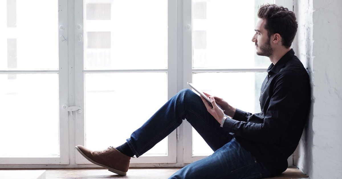 Man sitting against the wall