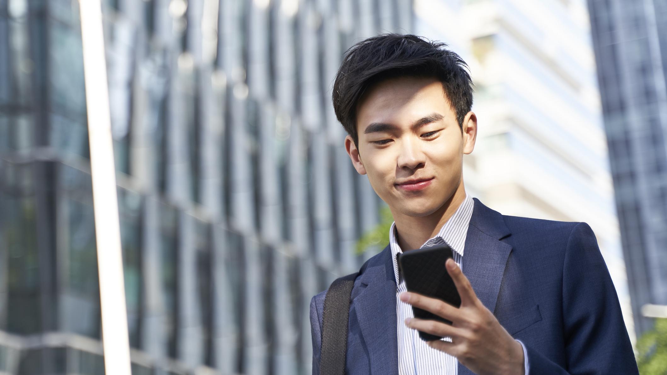 man looking at phone
