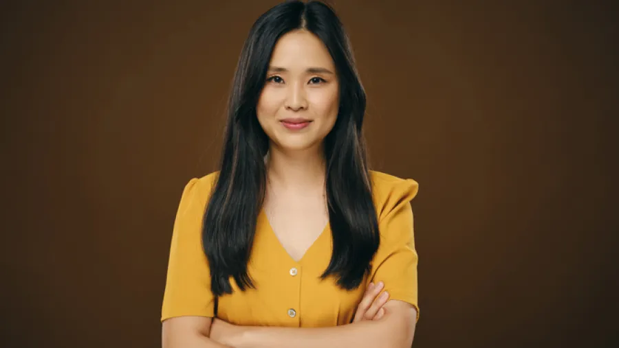 Woman standing with arms folded