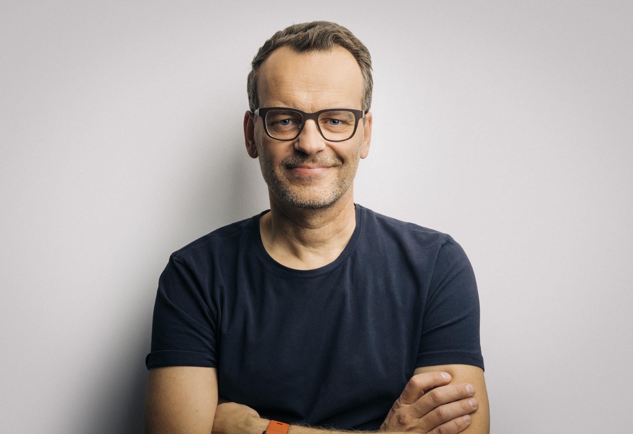 business professional with arms crossed in front