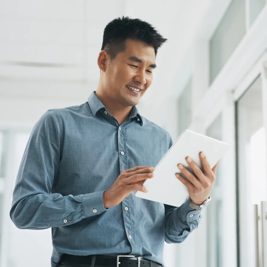 man looking at tablet