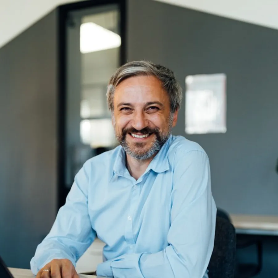 professional man seated at desk in office