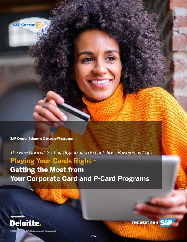 woman smiling with credit card and tablet