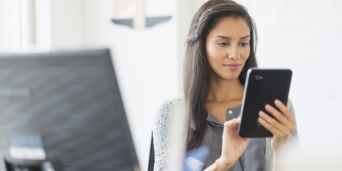 woman in office using a tablet